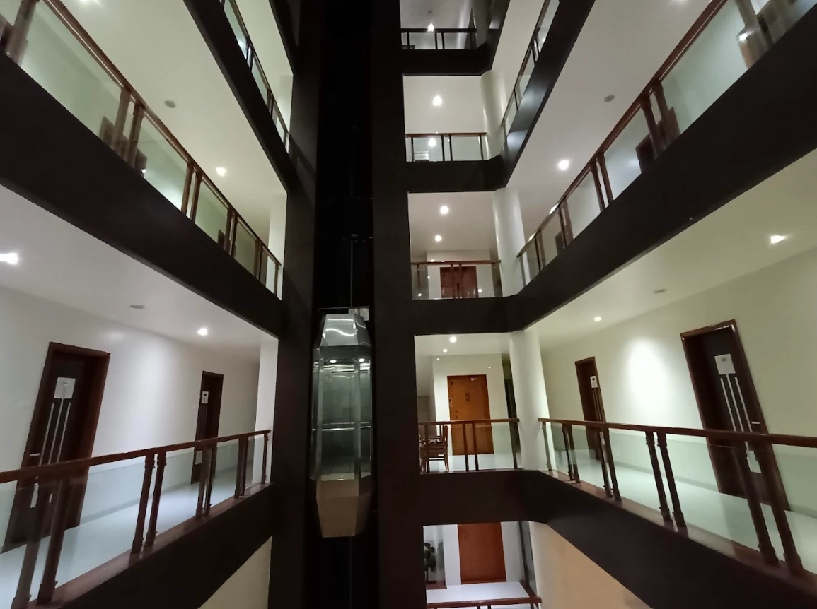 The open atrium and glass lift at Hotel Silver Palace